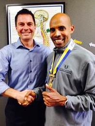 Pictured: Dr. Devin Young of Intouch Chiropractic and Boston Marathon Champion, Meb Keflezighi