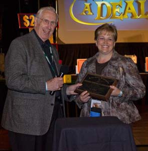 Dr. James Loftus presents the Palmer plaque to WCA Past President Dr. Sherry Walker during their event. 