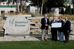 Jefferson County representatives accept a $5,000 endowment check from Standard Process Inc. to support Jefferson County parks. Pictured left to right are Joe Nehmer, Jefferson County Parks director; Charles C. DuBois, president of Standard Process; Charles Luthin, Natural Resources Foundation of Wisconsin executive director; and John Molinaro, Jefferson County Board chairman.