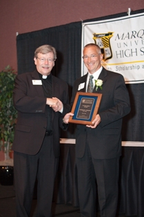 Marquette University High School President Rev. Warren Sazama, S.J., (left) presents Charles C. DuBois, president of Standard Process Inc., one of two 2011 Alumni Merit Awards.