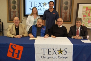 Texas Chiropractic College and Sam Houston State University signed an articulation agreement on Dec. 13, 2012. Present at the signing were: (seated, from left to right) TCC Dean of Academic Affairs Dr. John Mrozek, SHSU Director of Medical & Allied Health Programs Dr. Jack C. Turner, TCC Provost/Senior Vice Presidetn Dr. Clay McDonald, and TCC Vice President of Enrollment Management Dr. Fred Zuker; (standing, from left to right) current TCC and former SHSU students Jennifer Reed and Dave Mason. 