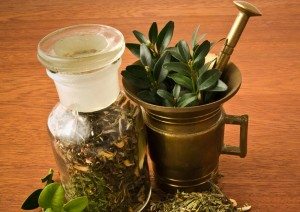 Herbs in metal pitcher and glass jar