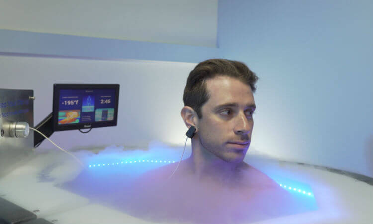 A person enjoying a chiropractic cryotherapy session in a practice