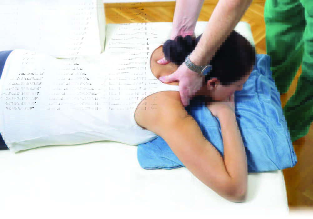 Woman laying down on chiropractic table.